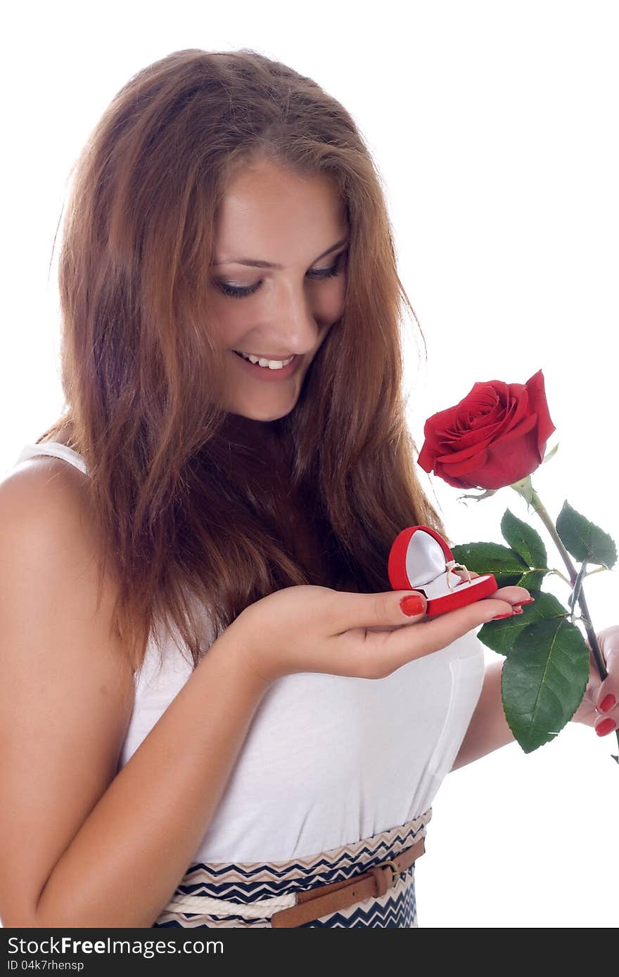 Girl holding jewellery gift box and flower.