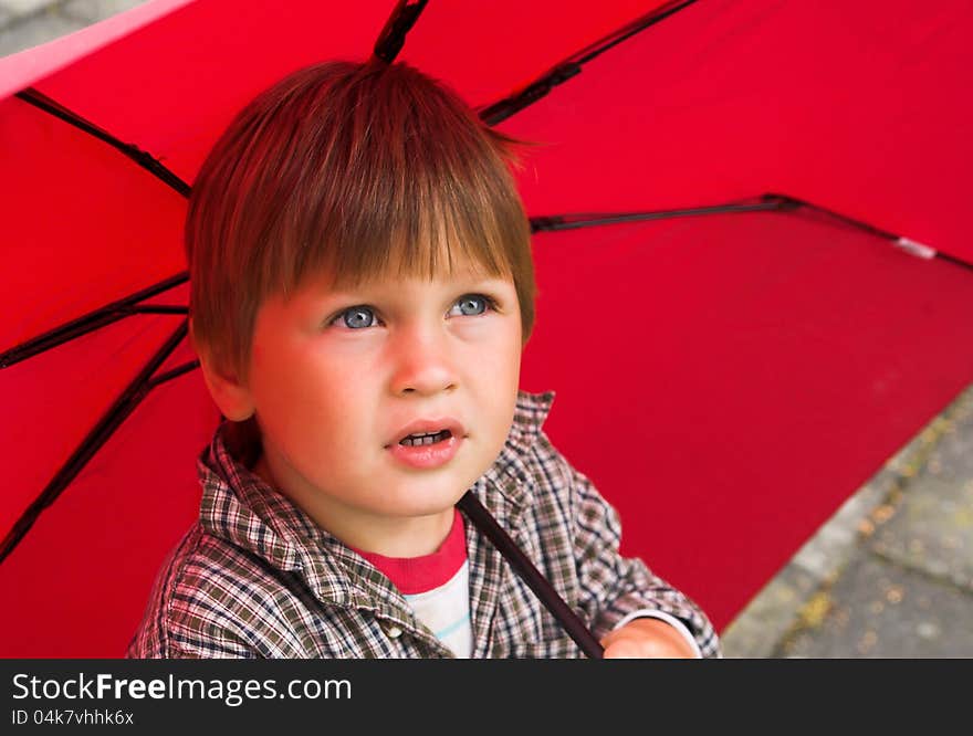 Boy with the red umbrella