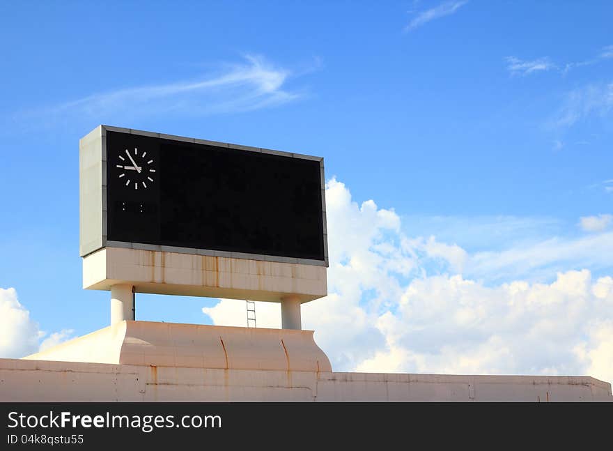 Score board on blue sky