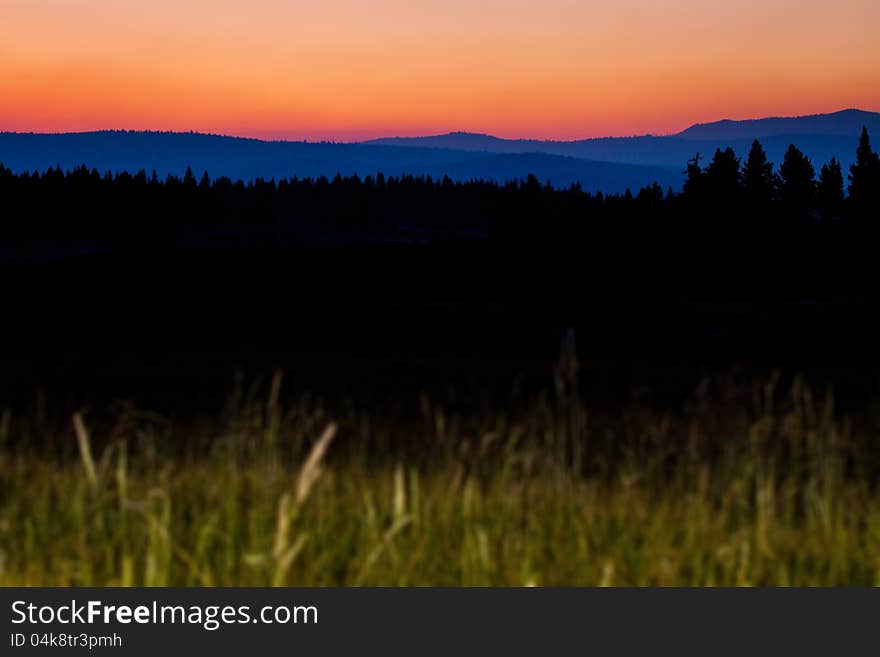 Distant Mountain ranges and tree line at sunset at Martis Creek, Truckee, California. Distant Mountain ranges and tree line at sunset at Martis Creek, Truckee, California