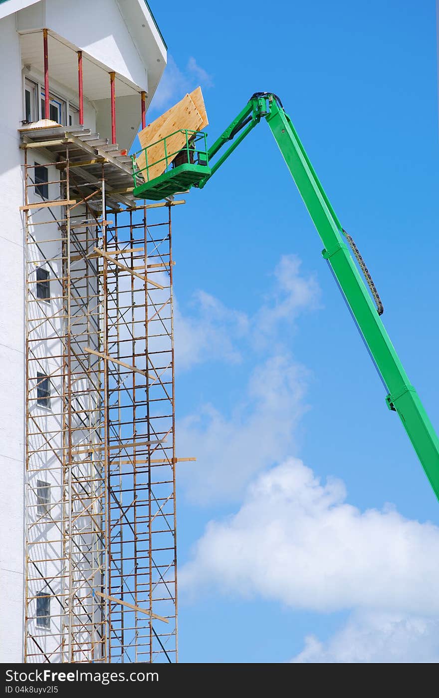 Construction Scaffolding And Lift On Tall Buiding