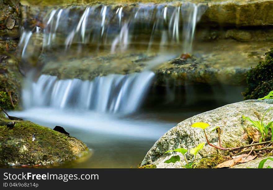 Beautiful veil cascading waterfalls, mossy rocks