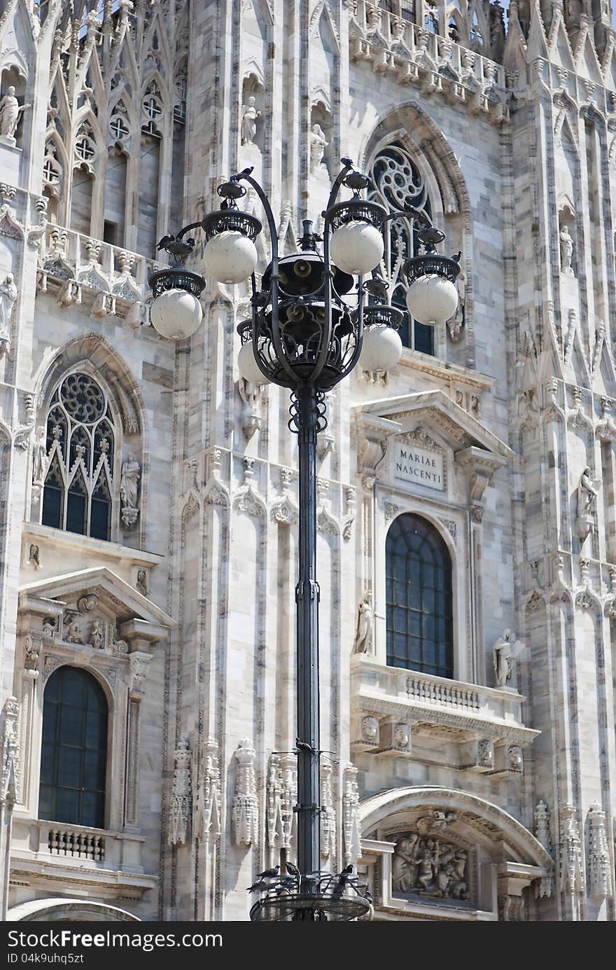 Ancient gothic lam post in front of the duomo of Milan. Ancient gothic lam post in front of the duomo of Milan