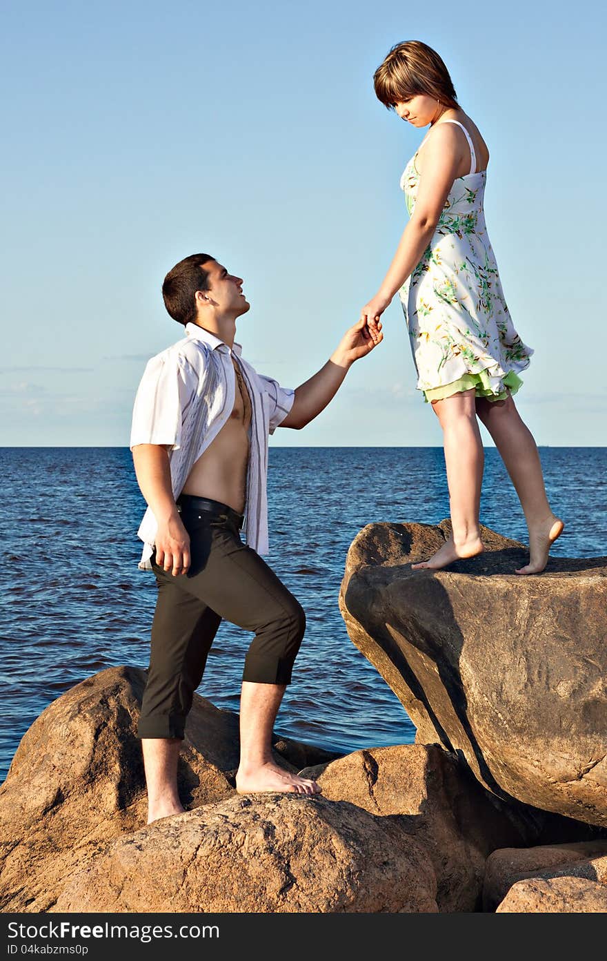 Recognized the guy in love and proposes to the girl by the lake. Recognized the guy in love and proposes to the girl by the lake