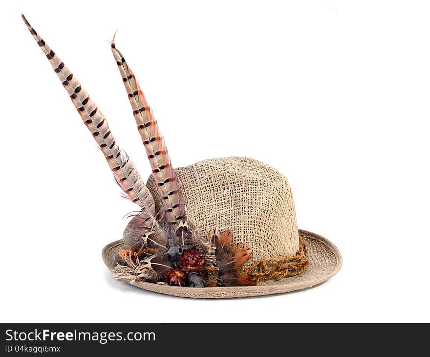 A hunting hat with pheasant feathers on white