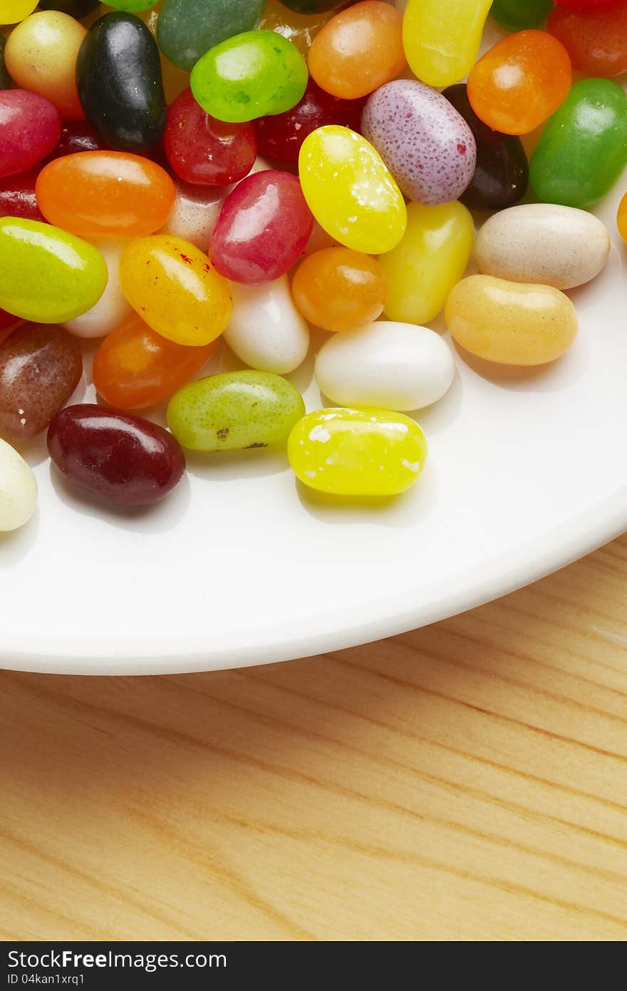 Colourful jelly beans in bowl on table