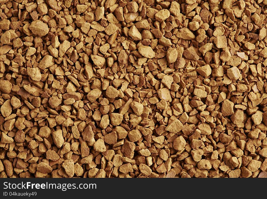 Instant coffee granules on white plate