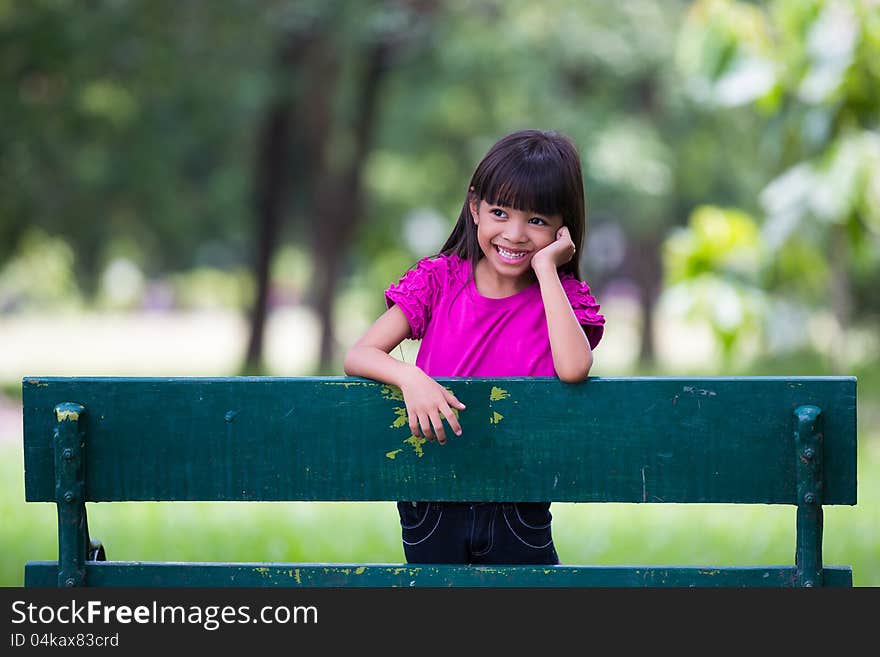 Smiling little girl at park, Outdoor portrait