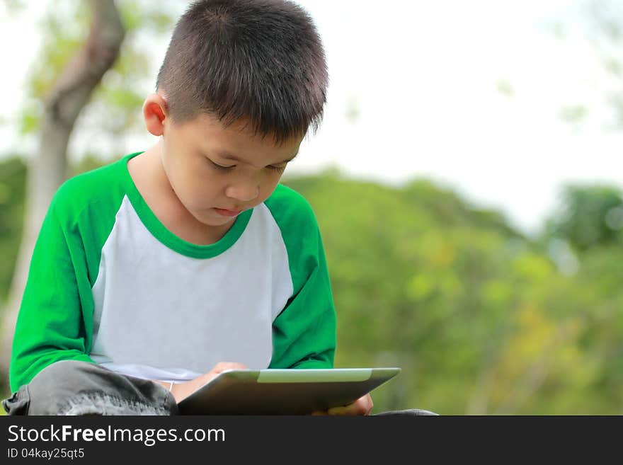 Boy using digital tablet