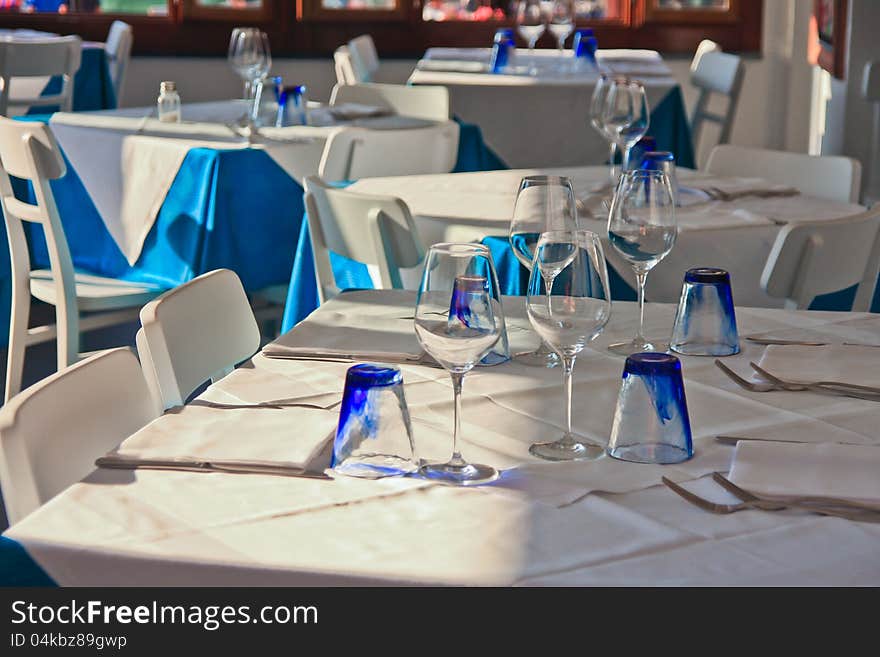 Table setting with wine glasses at restaurant in hotel resort. Table setting with wine glasses at restaurant in hotel resort