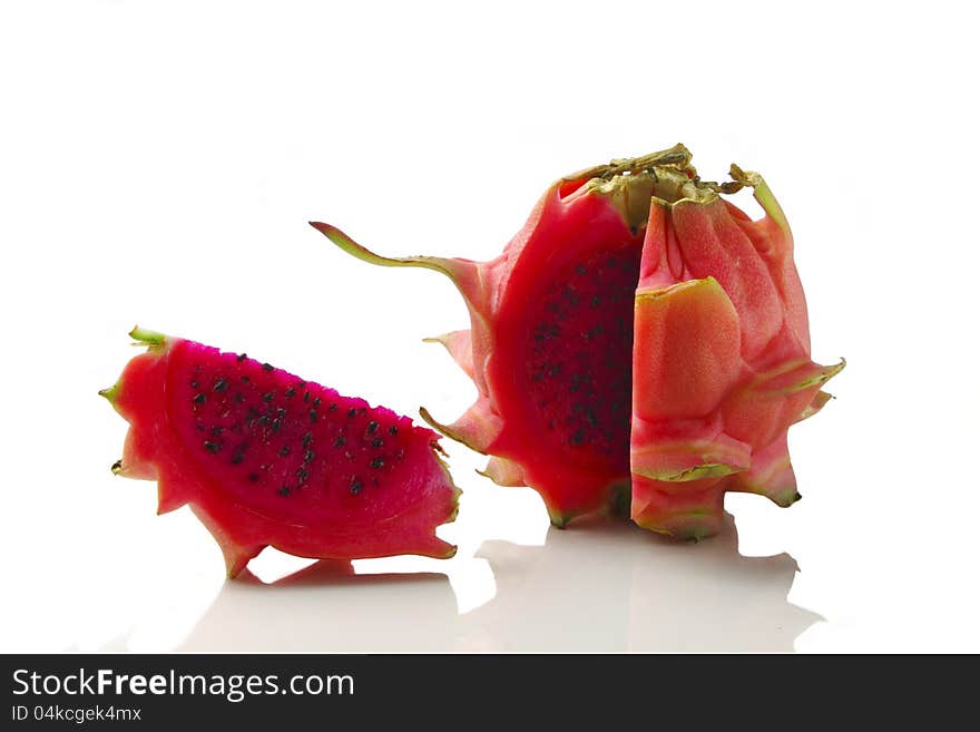 Vivid and vibrant red dragon fruit isolated on white. Vivid and vibrant red dragon fruit isolated on white