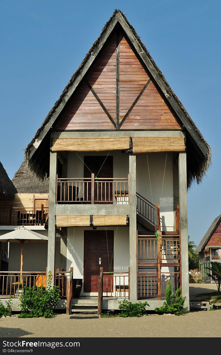 Chalet accomodation on a beach at a tropical resort. Chalet accomodation on a beach at a tropical resort