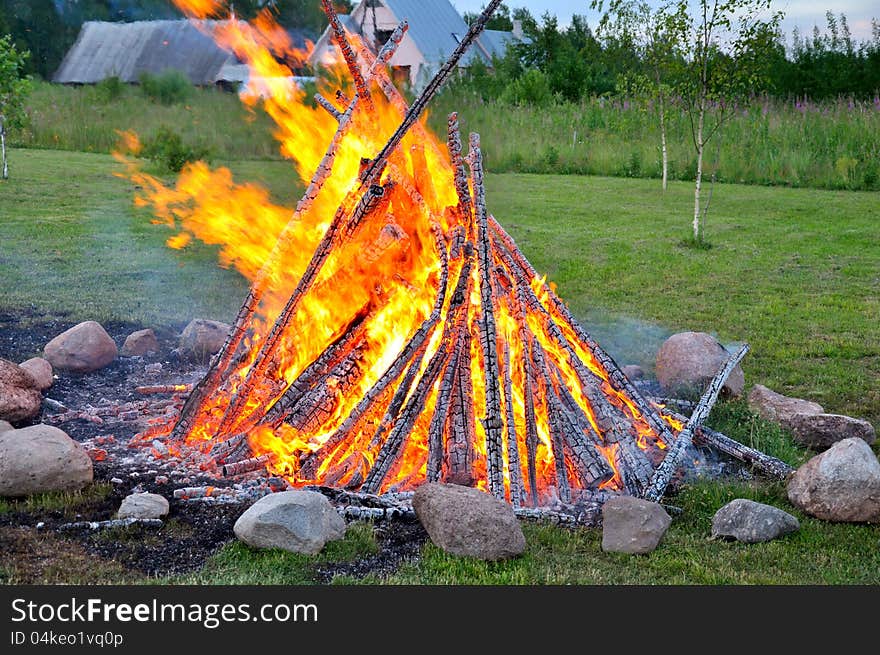 Landscape with bonfire and river