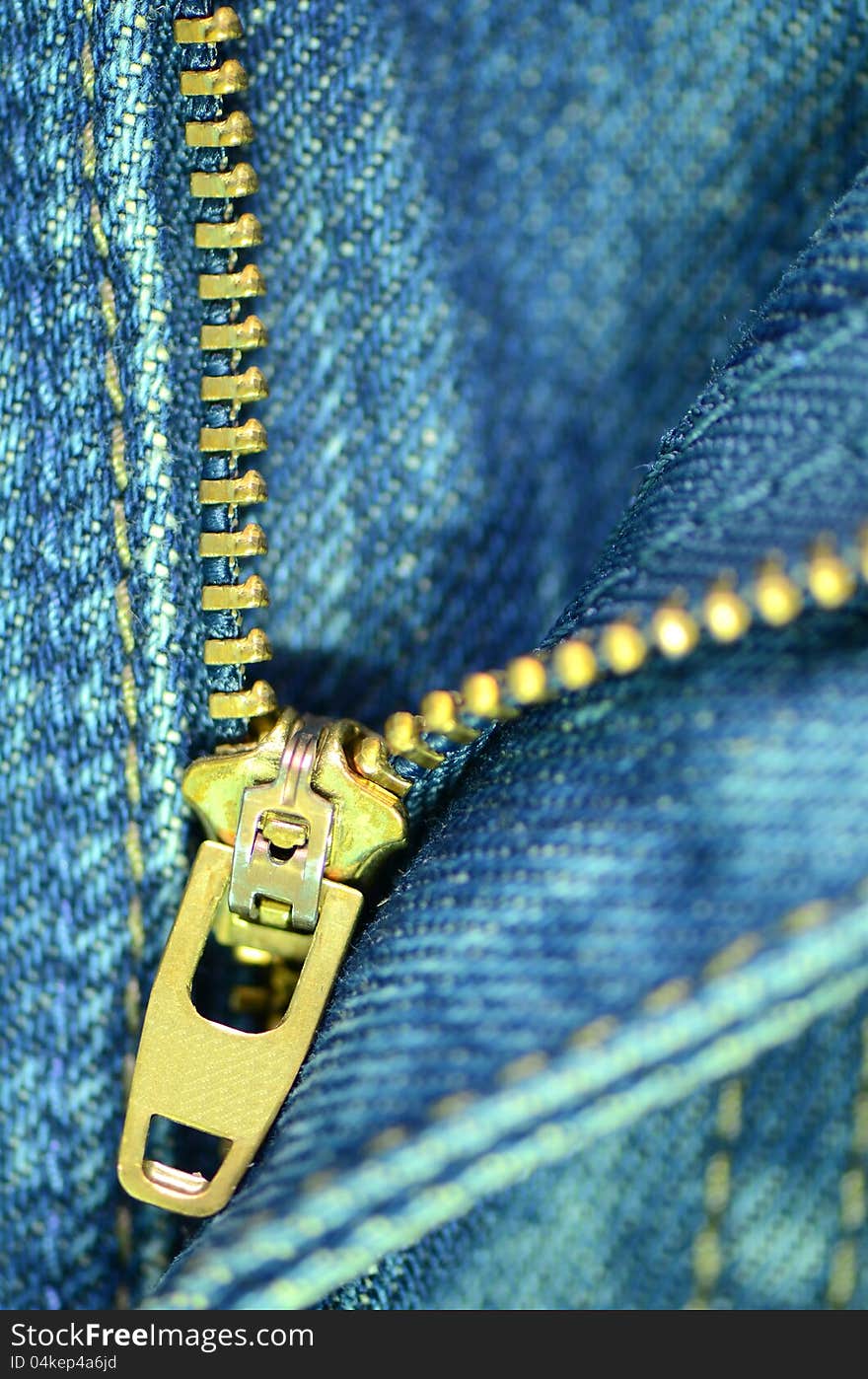 Zip of blue jeans.