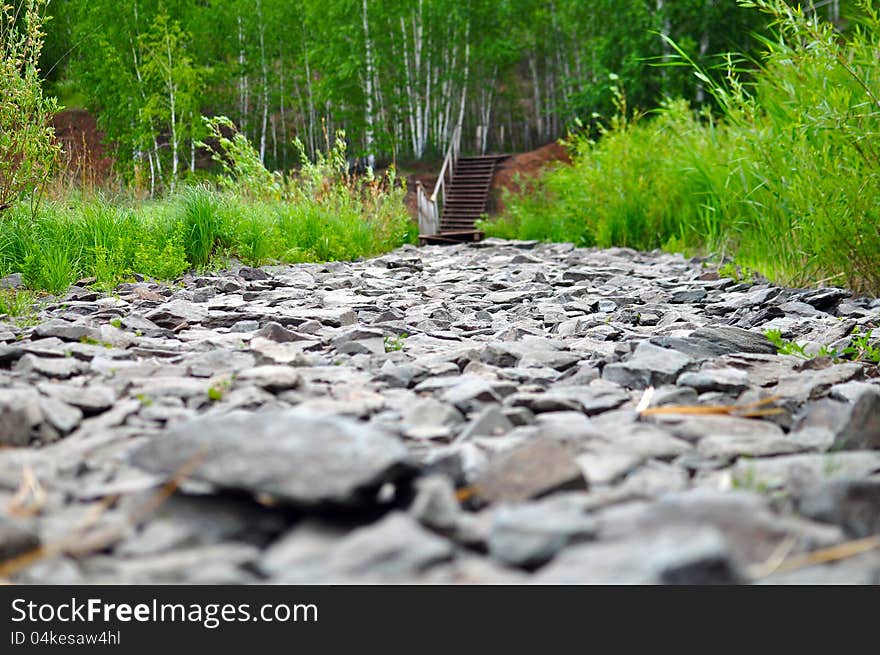 Road from a stone. wood ladder in ahead. Road from a stone. wood ladder in ahead