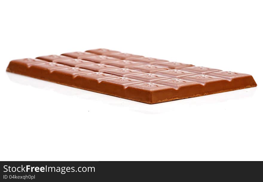 Milk chocolate bar isolated on white background. Side view.