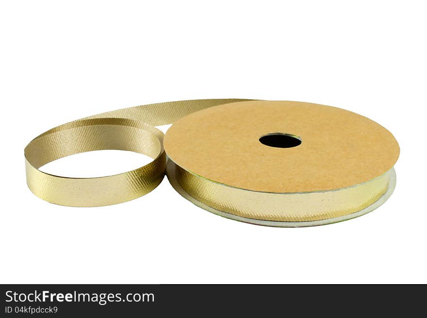 Roll of gold ribbon solated on white background. Roll of gold ribbon solated on white background