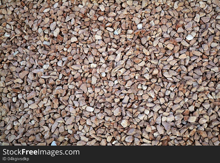 Red little stones background red. Red little stones background red