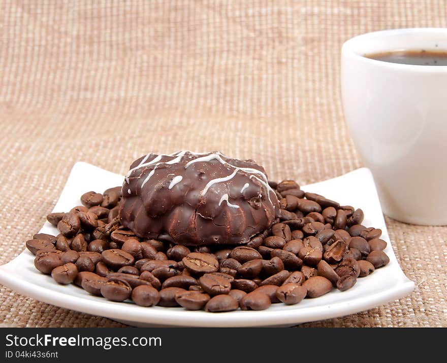 Chocolate Pastry Lies On Coffee Bob