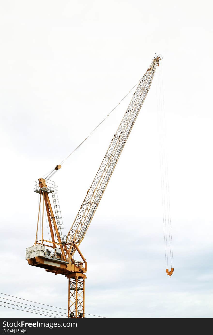 Useless hoist crane on sky background