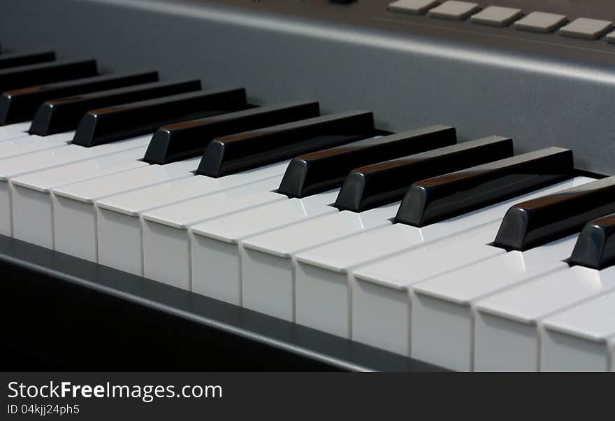 Modern electronic piano keyboard close-up