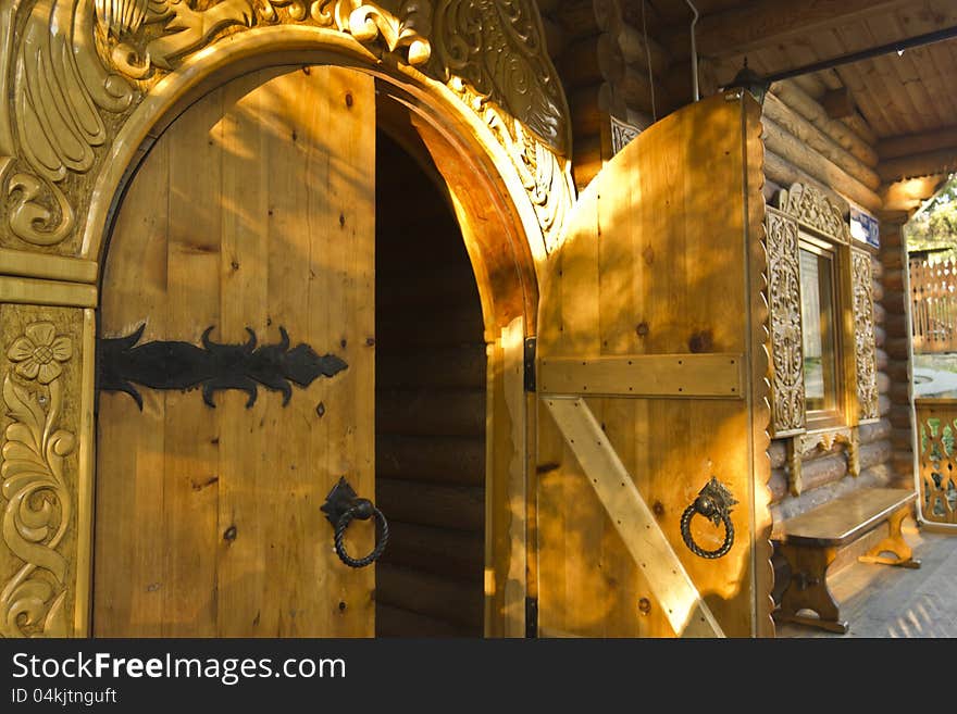 Wooden open door in Russian log hut. Wooden open door in Russian log hut