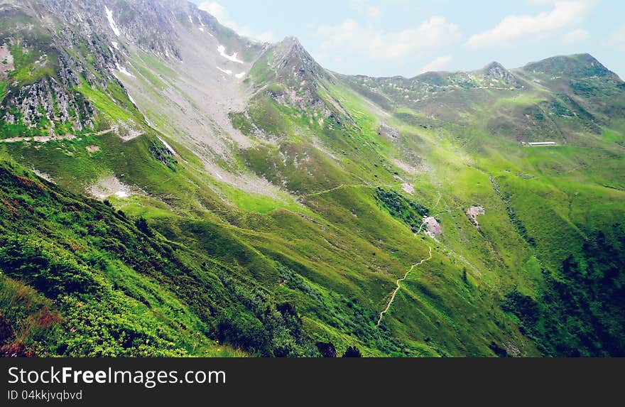 Nice view of the valley in the Tyrolean Alps on foot hike.