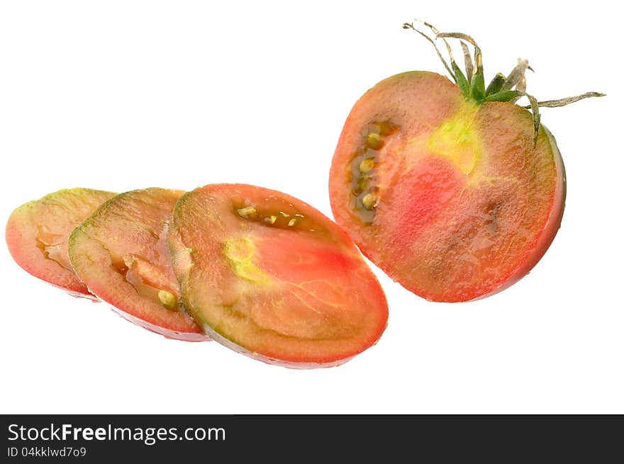 Sliced ripe black krim tomato isolated on white