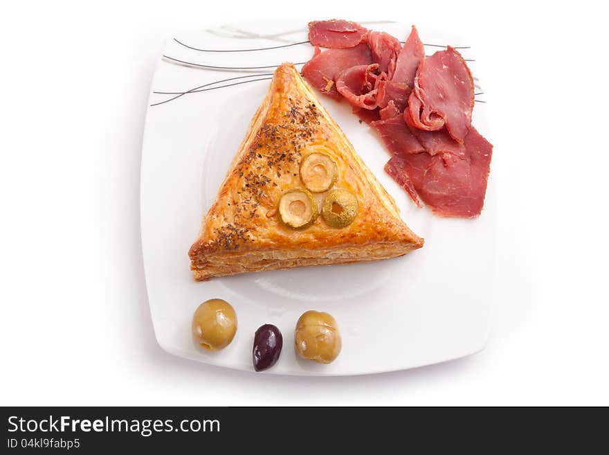 Pate stuffed Pastrami with olive on white dish. Pate stuffed Pastrami with olive on white dish