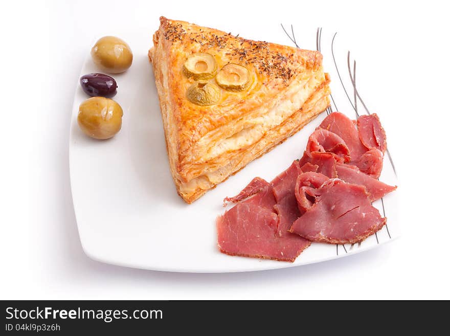 Pate stuffed Pastrami with olive on white dish. Pate stuffed Pastrami with olive on white dish