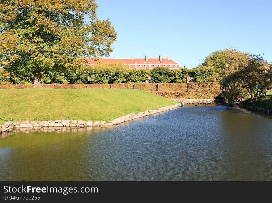 Waterfilled moat surrounding a beautiful garden. Waterfilled moat surrounding a beautiful garden