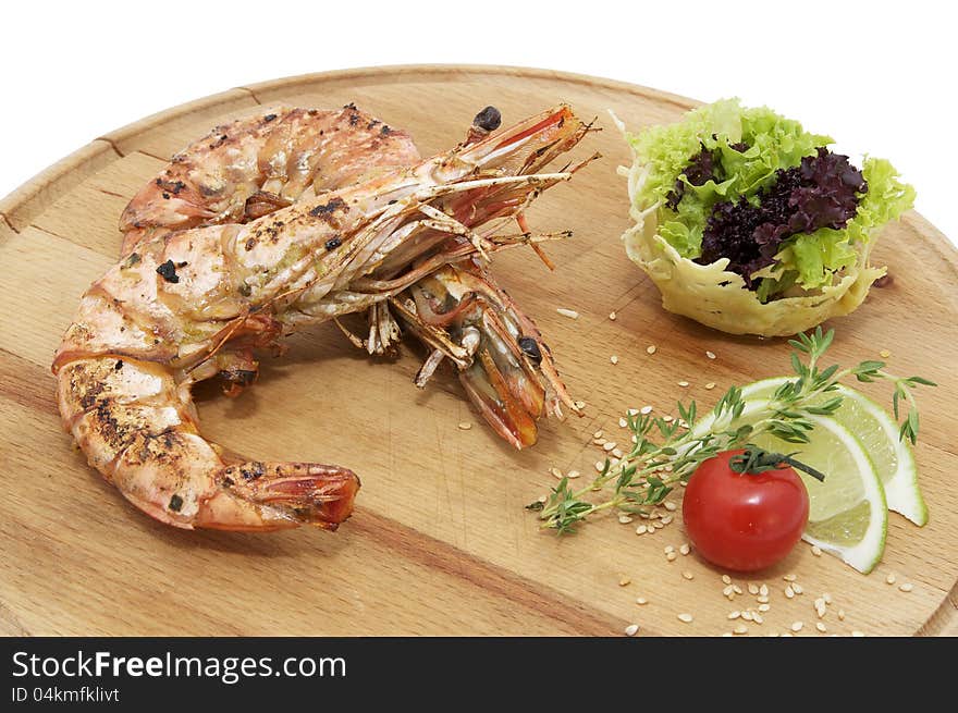 Grilled Shrimp with Orange on a wooden plate