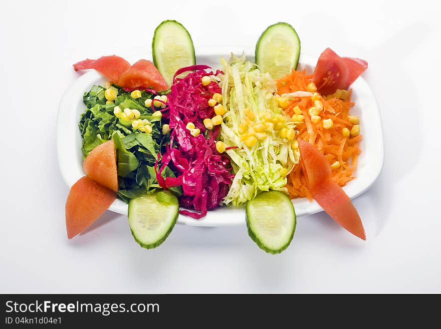 Fresh salad bowl on white background