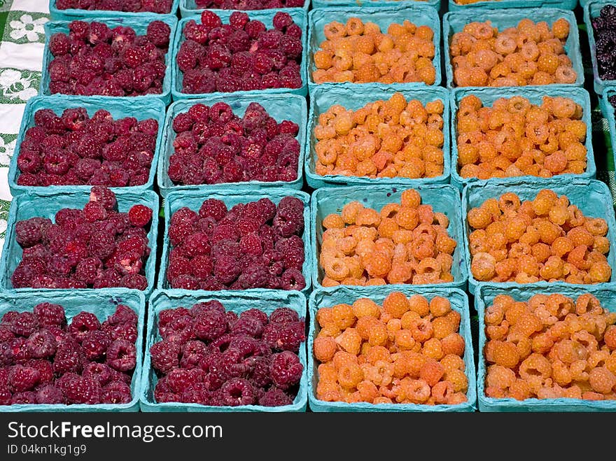 Red and yellow Raspberries on display for sale