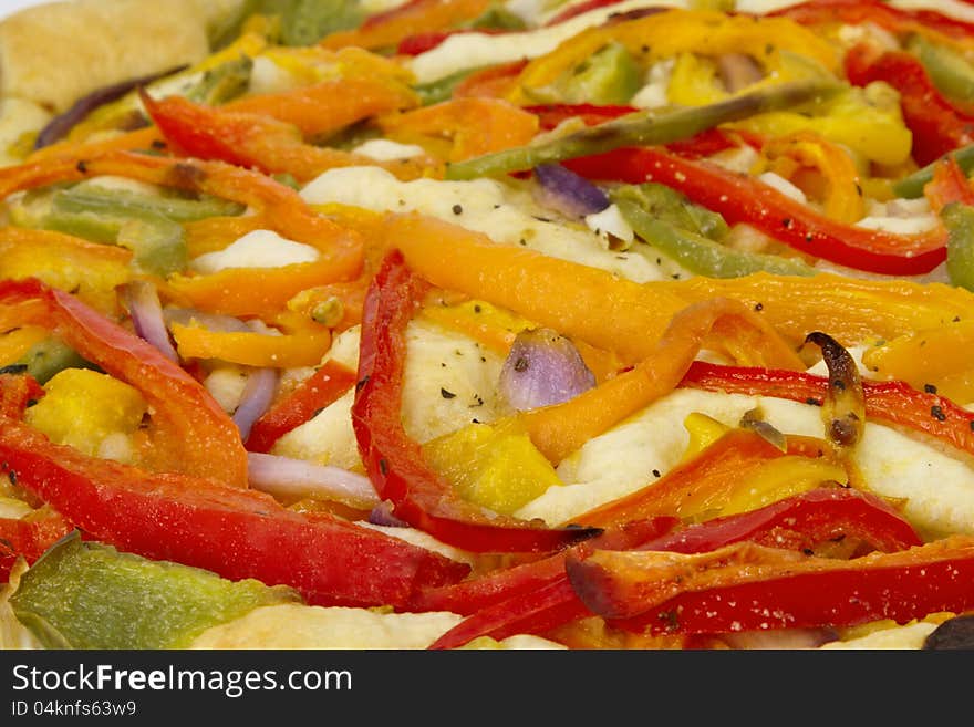 Close up of tri-color peppers and onion foccacia; vegetarian pizza;. Close up of tri-color peppers and onion foccacia; vegetarian pizza;