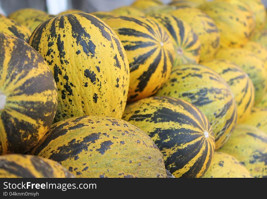 Yellow and green melons at the market stand from Turkey