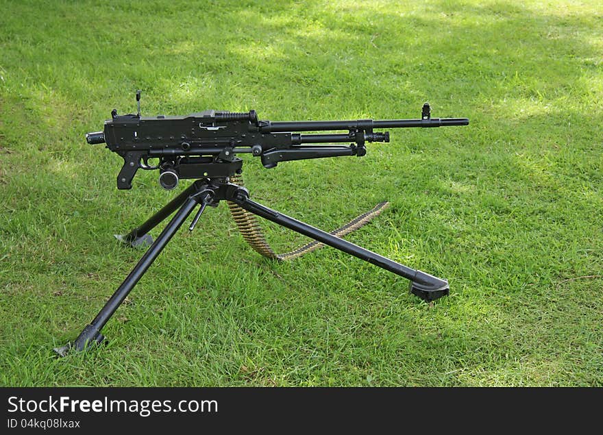 A Modern Military Machine Gun Set Up On Grass. A Modern Military Machine Gun Set Up On Grass.