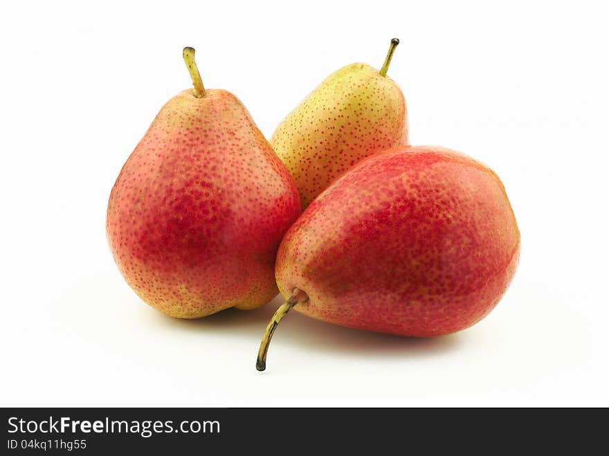 Three delicious red pears on white background. Three delicious red pears on white background