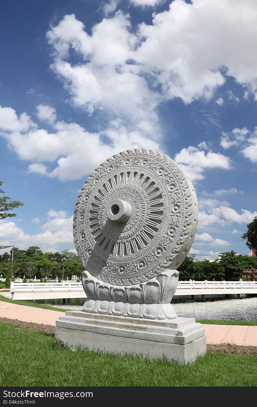 Wheel of Dhamma the sign of Buddhism at Wat Phra Sri Mahathat temple, Bangkok, Thailand. Wheel of Dhamma the sign of Buddhism at Wat Phra Sri Mahathat temple, Bangkok, Thailand.