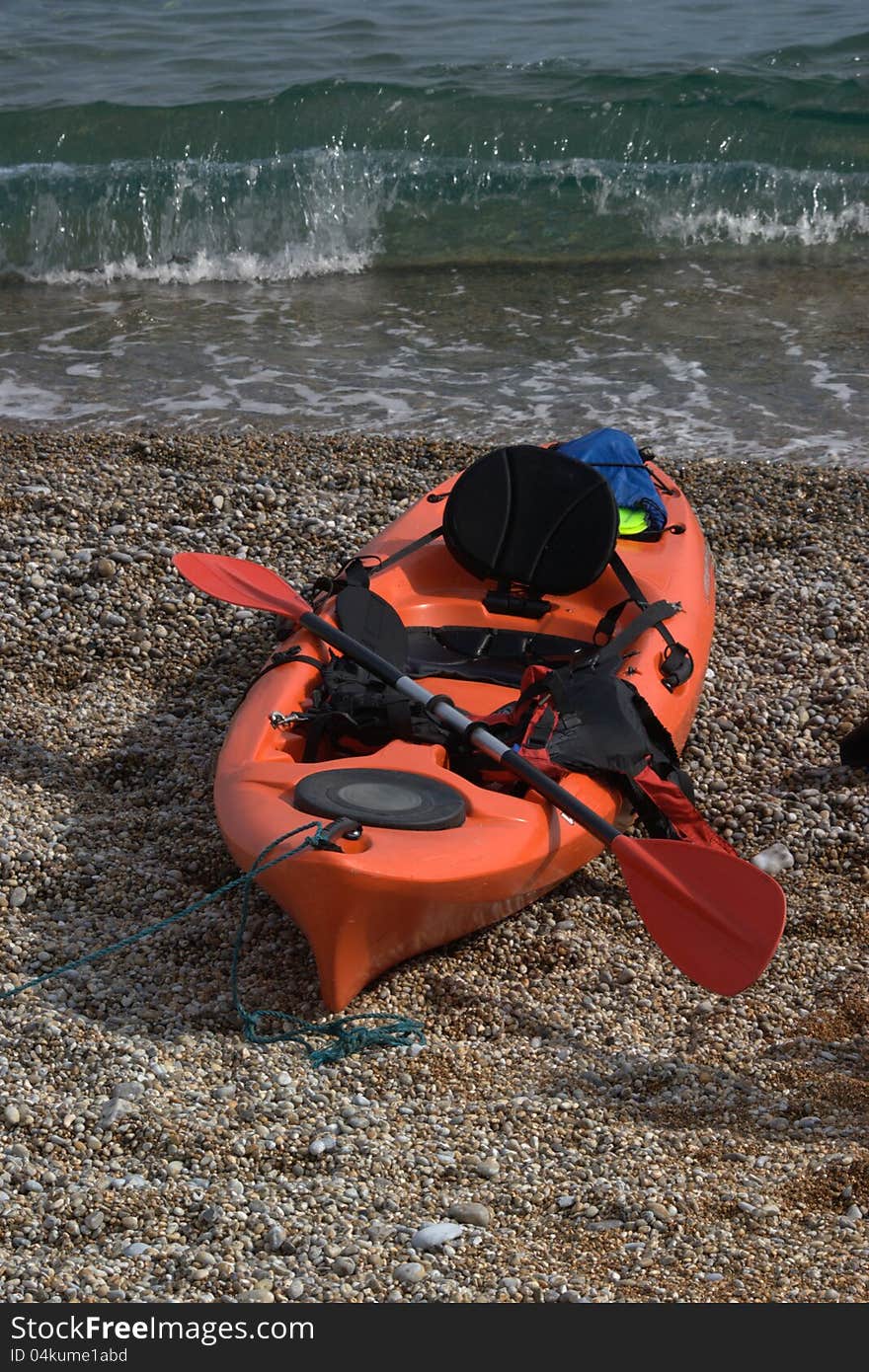 Kayak On A Pebble Beach