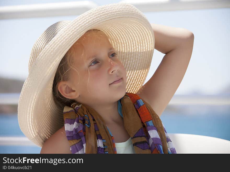 Portrait of a girl wearing a hat outdoors during the day in the summer. Portrait of a girl wearing a hat outdoors during the day in the summer