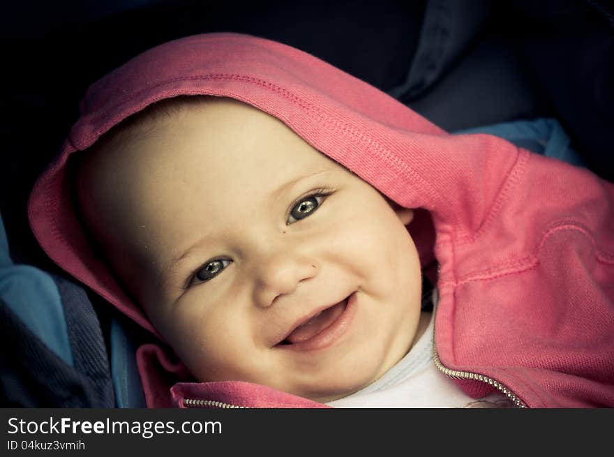 Baby girl with pink hood. Baby girl with pink hood