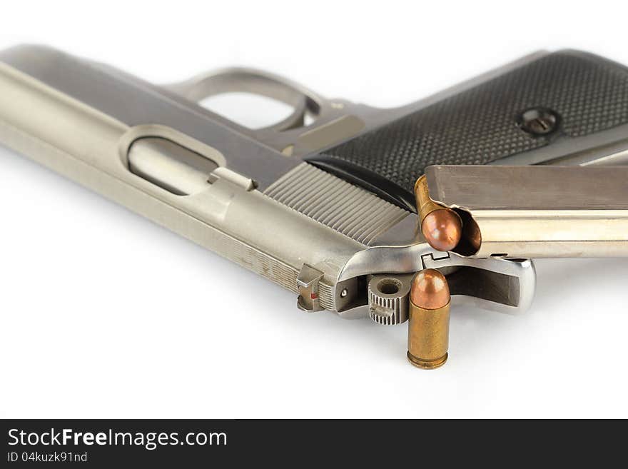 Close up of bullets and Semi-automatic gun on white background