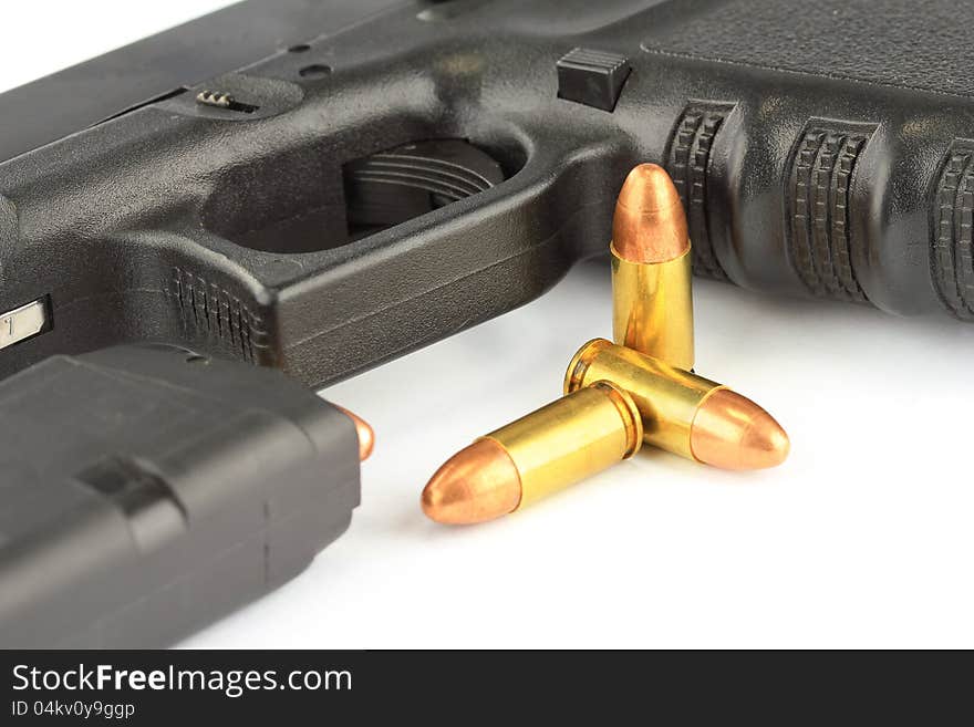 Close up of bullets and Semi-automatic gun on white background