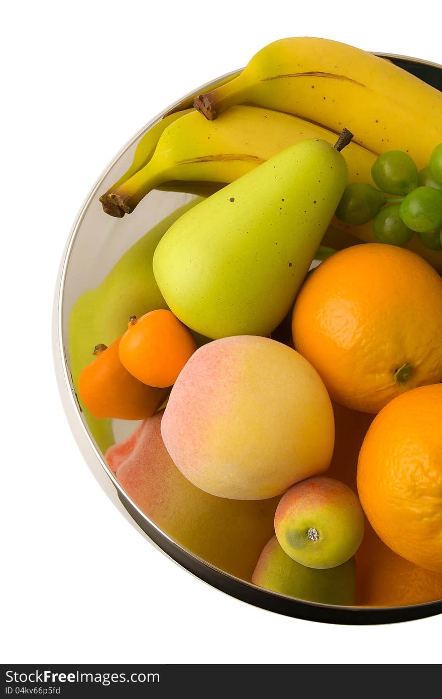 Fruits on shining metal centerpiece. Fruits on shining metal centerpiece