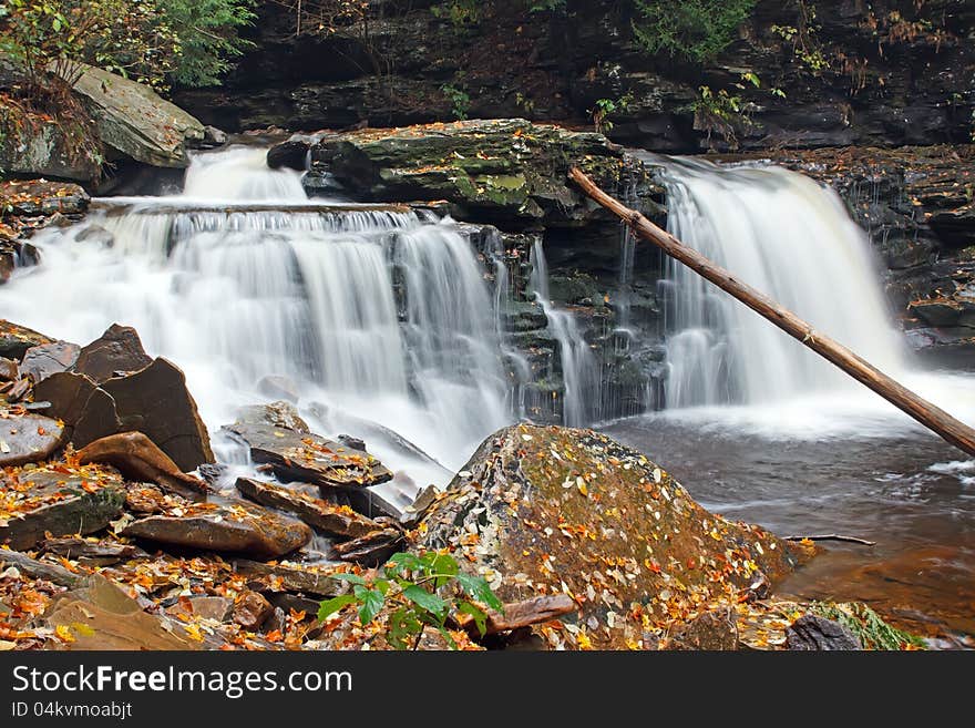 Waterfall With Autumn Leaves