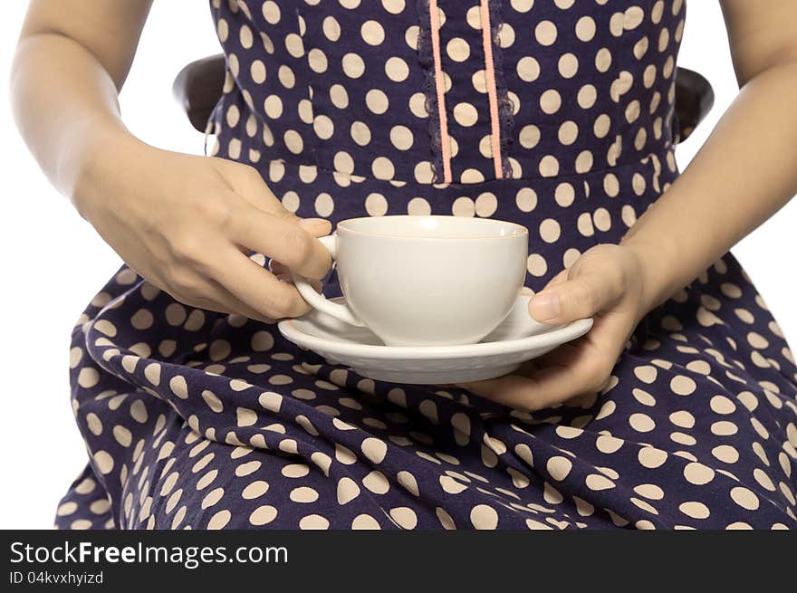 Woman wearing retro dress hold a cup of coffee. Woman wearing retro dress hold a cup of coffee