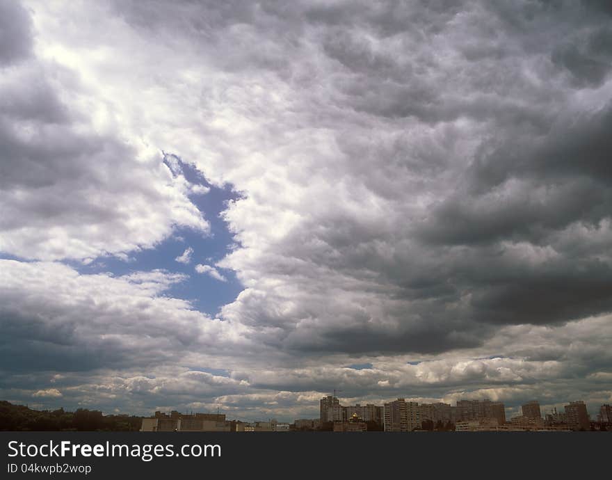 Dramatic sky over a city. Dramatic sky over a city.