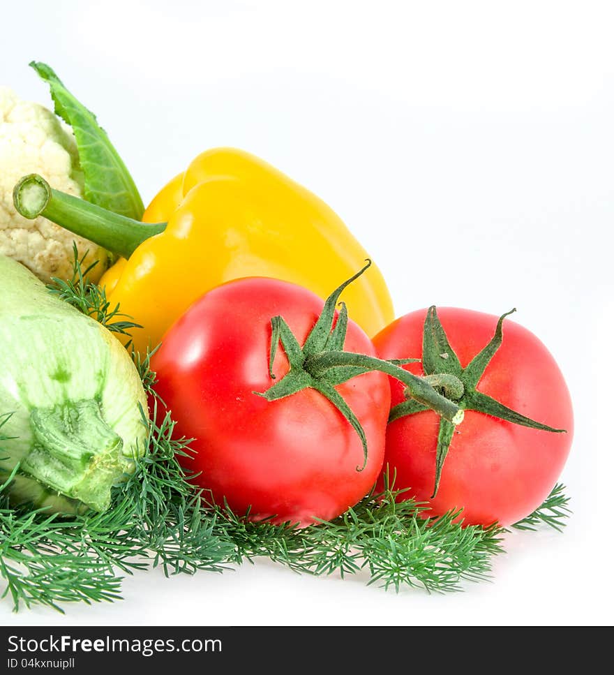 Two tomatoes, pepper and vegetable marrow