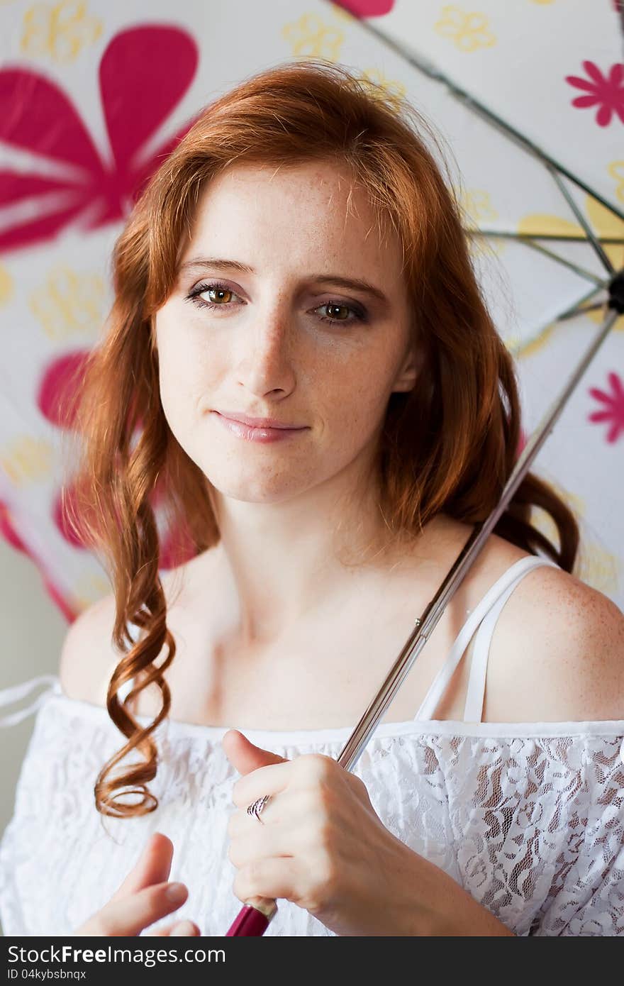 Red-haired girl with an umbrella. Red-haired girl with an umbrella